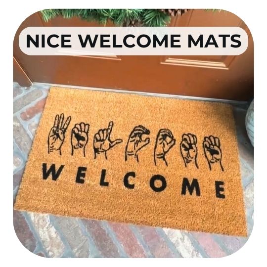 ASL welcome mat on a brick patio