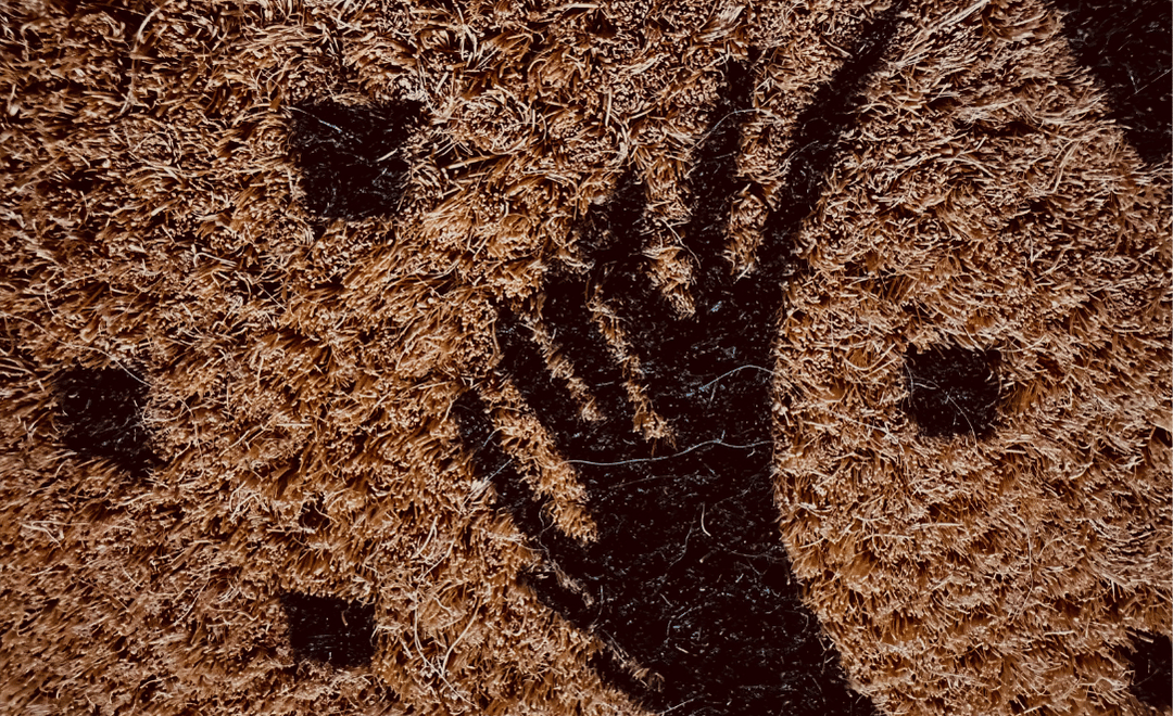 Close-up of the printed dog design on a Cave Canem coir doormat
