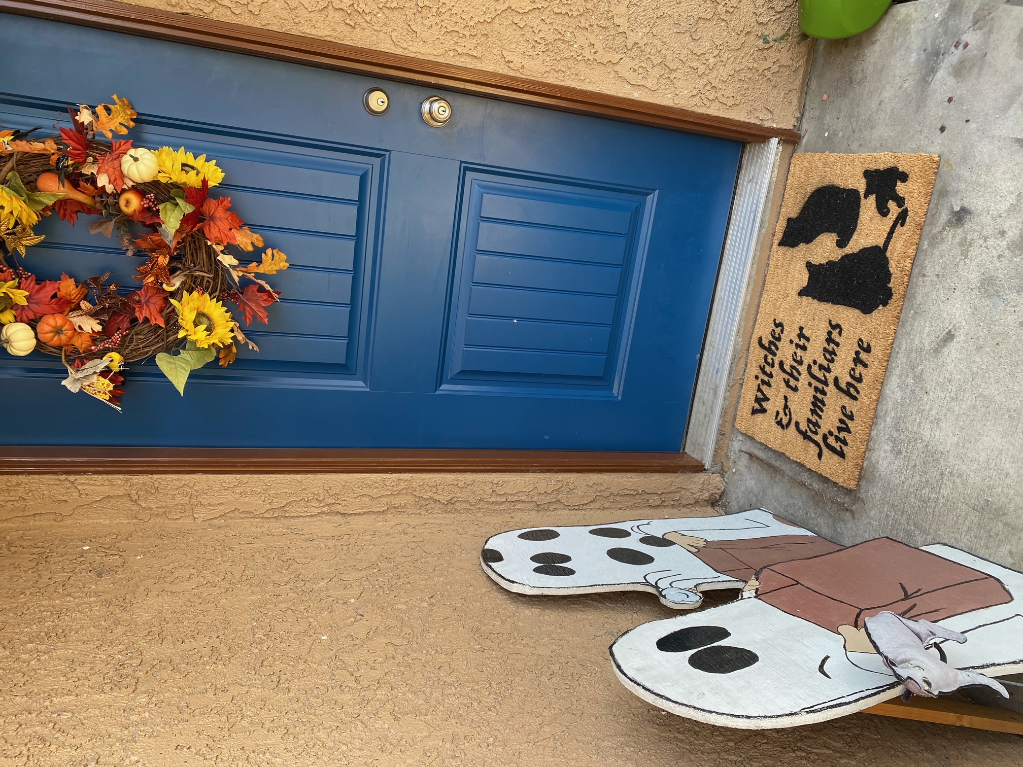Witch & her Familiar Black Cat Halloween doormat at a seasonal doorway