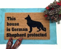 This house is German Shepard protected dog door mat