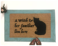 a witch and her familiar live here black cat halloween gothic home doormat