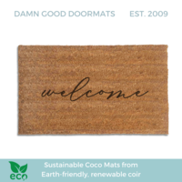 handwritten cursive welcome on a natural coir doormat