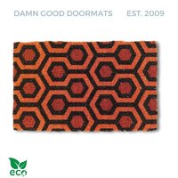 Coir doormat with orange and red hexagon pattern inspired by The Shining hotel carpet