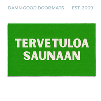 Natural coir Green doormat with white text reading tervetuloa saunaan, a Finnish sauna welcome mat