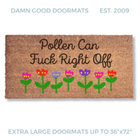 promotional image of a coir doormat reading "pollen can fuck right off" in cursive with red and purple tulips across the bottom
