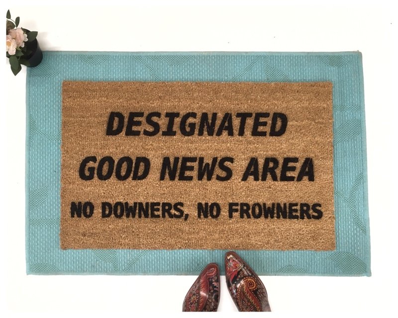Designated Good News Area- no downers, no frowners! This funny doormat