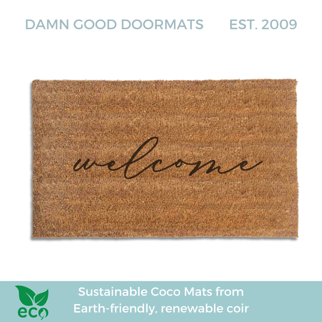 handwritten cursive welcome on a natural coir doormat