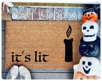 hocus pocus doormat reading it's lit with the black flame candle