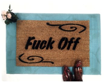 Natural coir doormat with Fuck Off printed in bold black letters with custom border — the original rude welcome mat
