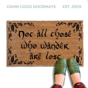 Brown coir doormat with tree ring design and Not All Those Who Wander Are Lost Tolkien quote